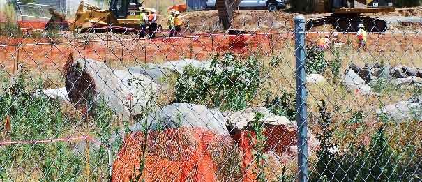 Circle of rocks, a traditional medicine wheel symbol, on site denotes sacred ancient burial ground (photo by Leon Thompson)