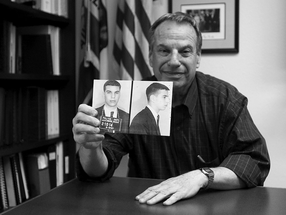 Rep. Filner proudly displays his "Freedom Ride" mugshots; photo by Ron Logan